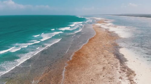 Ocean Coastline and Barrier Reef at Low Tide Zanzibar Matemwe Aerial View