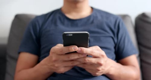 Man use of smart phone at home