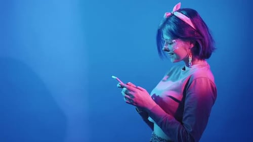 Woman in Futuristic Glasses Uses Smartphone