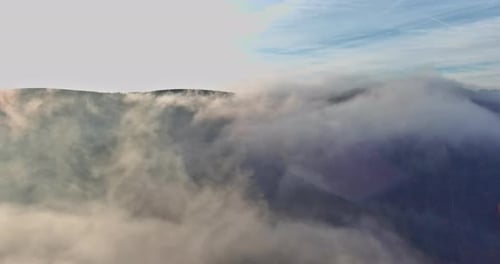 Beautiful Panorama of Aerial View on Forested Mountain Slope with Fog