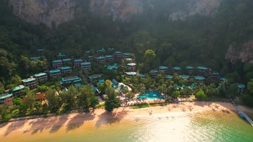 An aerial view of the villa amidst the beautiful sea and sand