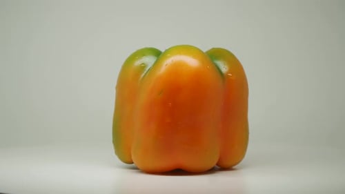 A Yellow Bell Pepper On Pure White White Background - Close Up Shot