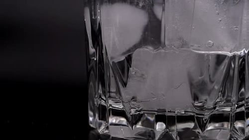 Ice Cubes Melting in a Glass