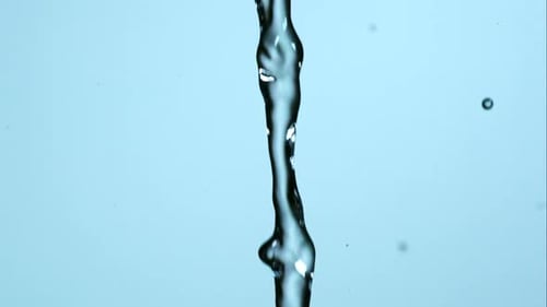 Water pouring and splashing in ultra slow motion 1500fps on a reflective surface - WATER POURS