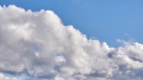 White Clouds Drifting Across a Blue Sky