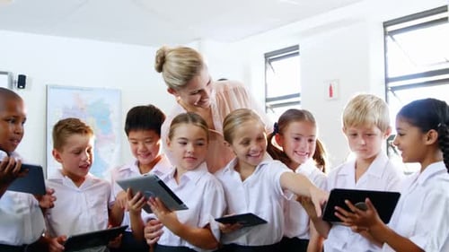 Enthusiastic Students Learn with Tablets in Classroom