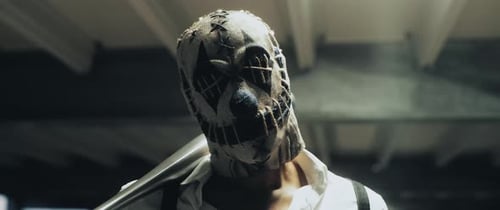 Creepy Masked Figure with Baseball Bat Threatens