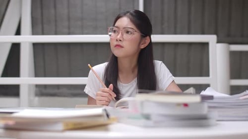 Young Adult Studying Hard at Home