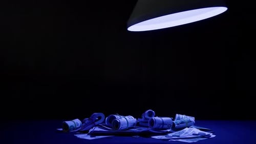 Pile of Euro Bills Under a Dramatic Light