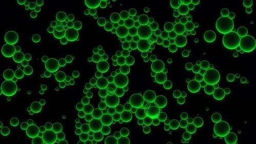 Oil green drops moving in water. Abstract background