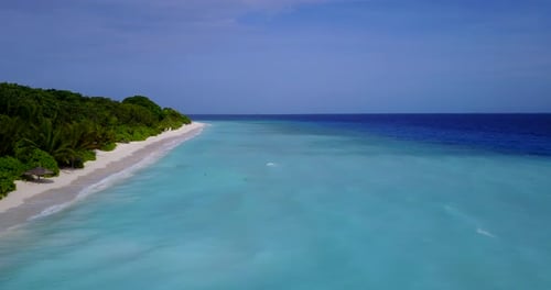 Natural above travel shot of a summer white paradise sand beach and aqua blue water background