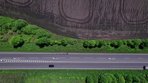 Aerial View of Road Passing Through a Rural Landscape