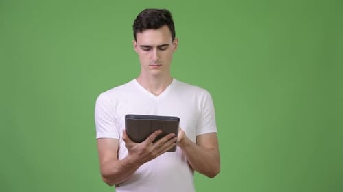 Young Handsome Man Using Digital Tablet