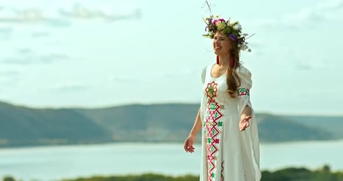 Young Woman in Embroidered Dress by Lake