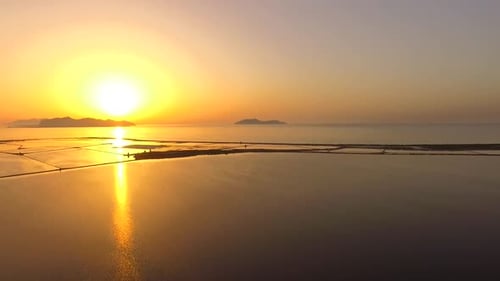 Aerial view of a lake at sunset.