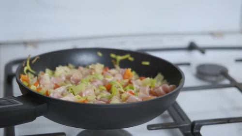 Chopped Chicken and Vegetables Cooking in Pan