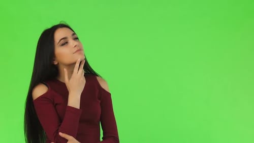 Pensive Woman Thinking in Front of Green Screen