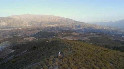 Off Road Motocross Bikers in a Mountainous Landscape