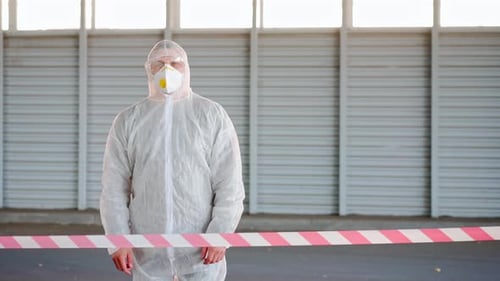 Man Epidemiologist Showing Stop Sign Standing Restricted Area Warning Red White Tape Coronavirus