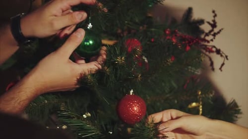 Family Decorate Christmas Tree Close Up