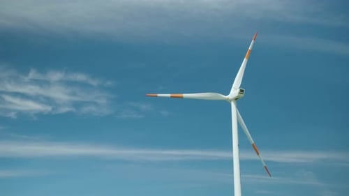 Blue sky and wind turbine. Green Energy.