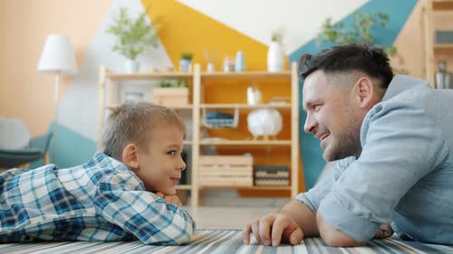 Cheerful Father and Child Bonding at Home
