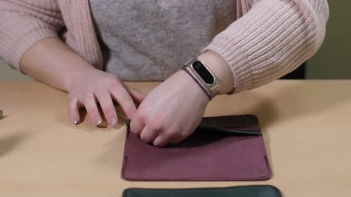 Leather Wallet Construction on Wooden Table