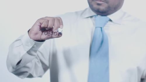 Asian Businessman Writes Tuesday