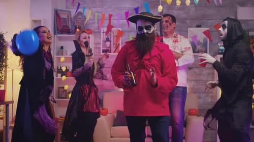 Adults Dancing at a Halloween Costume Party