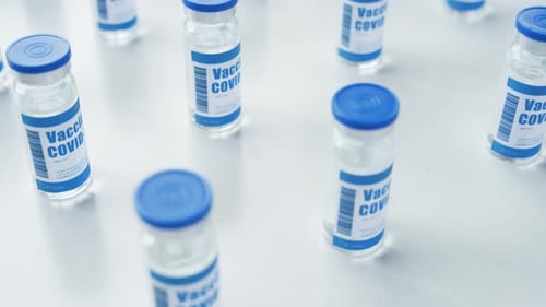 Vials of Covid Vaccine on White Surface