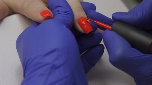 Applying Red Nail Polish for Manicure