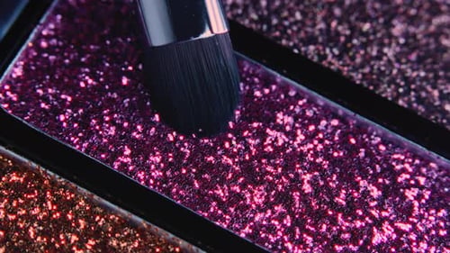 Macro View of Makeup Artist Working with Eyeshadow Sparkle Palette
