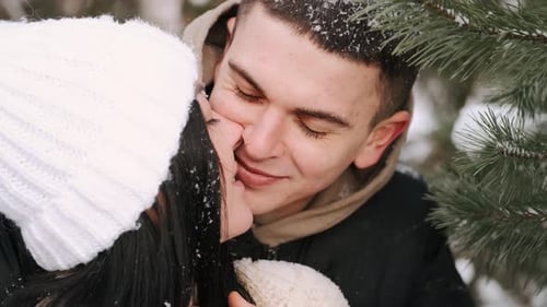Loveling Couple of Young People Hav Date in Forest in Winter