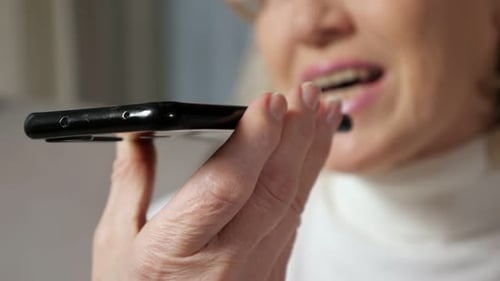 Woman Talking Into Smartphone Voice Message Close Up