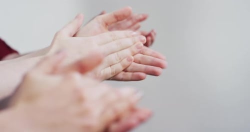 Close up of hands applauding