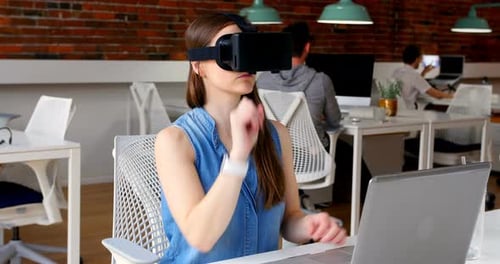 Woman Using VR Headset in Modern Office