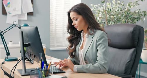 Beautiful Secretary of Company Assistant to Boss Manager Sits at Desk in Office in Front of the