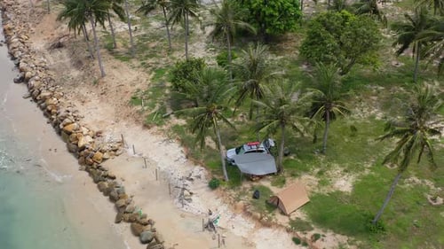 Tent and car on the sea shore