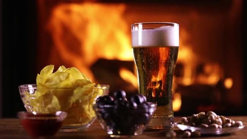 Relaxing with Beer and Snacks by the Fireplace