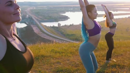 Women Exercising Outdoors in the Sunset