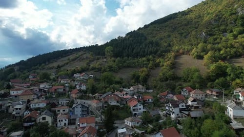 Village Nestled at the Foot of Mountain