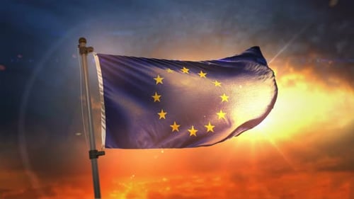 Waving European Union Flag Against Sunrise Sky