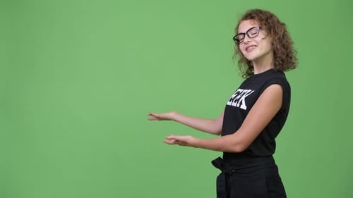 Young Woman Presenting On Green Screen