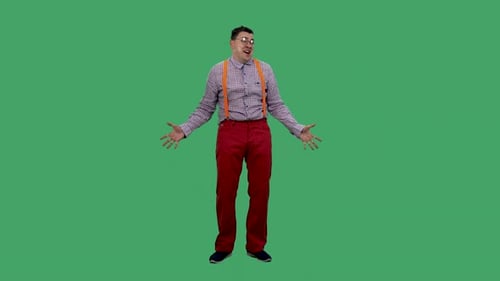 Man talking with arms outstretched on green screen