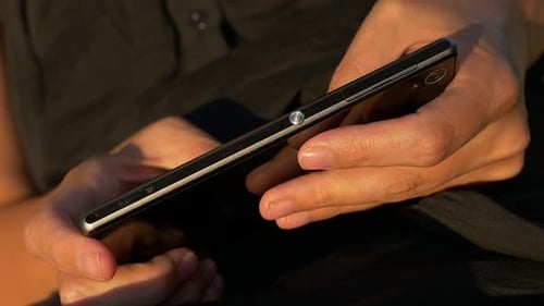 Close Up of Cellphone Held in Hands
