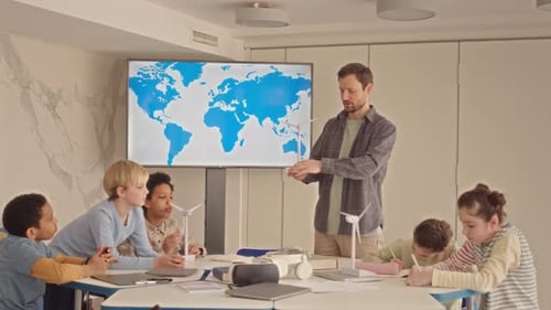 Teacher Explains Wind Turbines to Students in Classroom