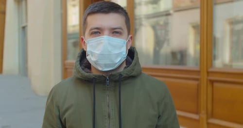 Man Wearing Face Mask in Urban Setting