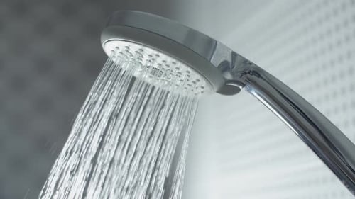 Shower Head Sprays Refreshing Water in Modern Bathroom