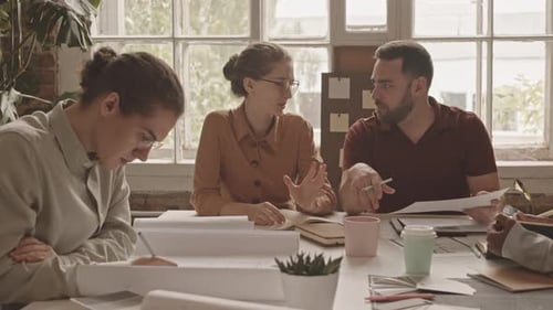 Team of Designers Brainstorming in Office