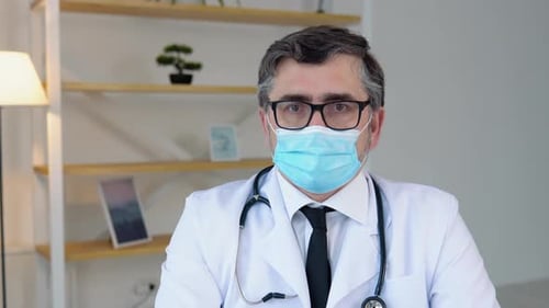 Doctor Wearing Mask Looking at Camera Close Up